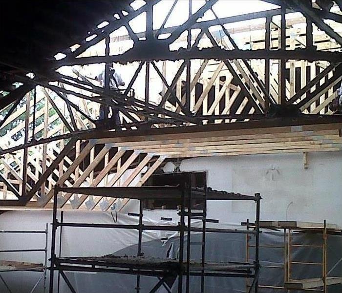 Wooden structure of a roof, roof damaged by fire.