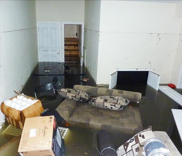 Completely flooded basement. It is visible line showing maximum water level higher than 7 feet.